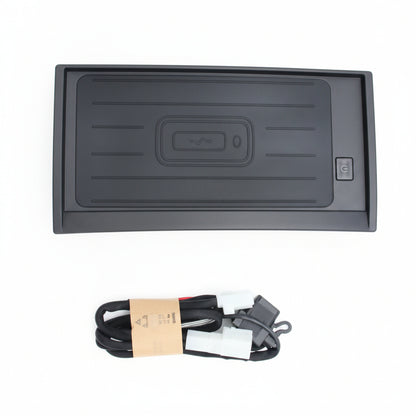 Black rectangular device with a cable on a white background