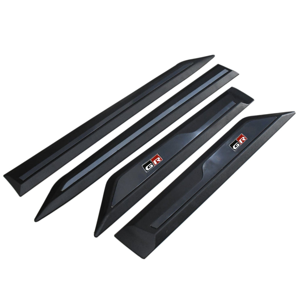 Set of black car side cladding with 'GR' logo on a white background
