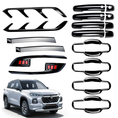 Set of car accessories including chrome strips and emblems on a white background