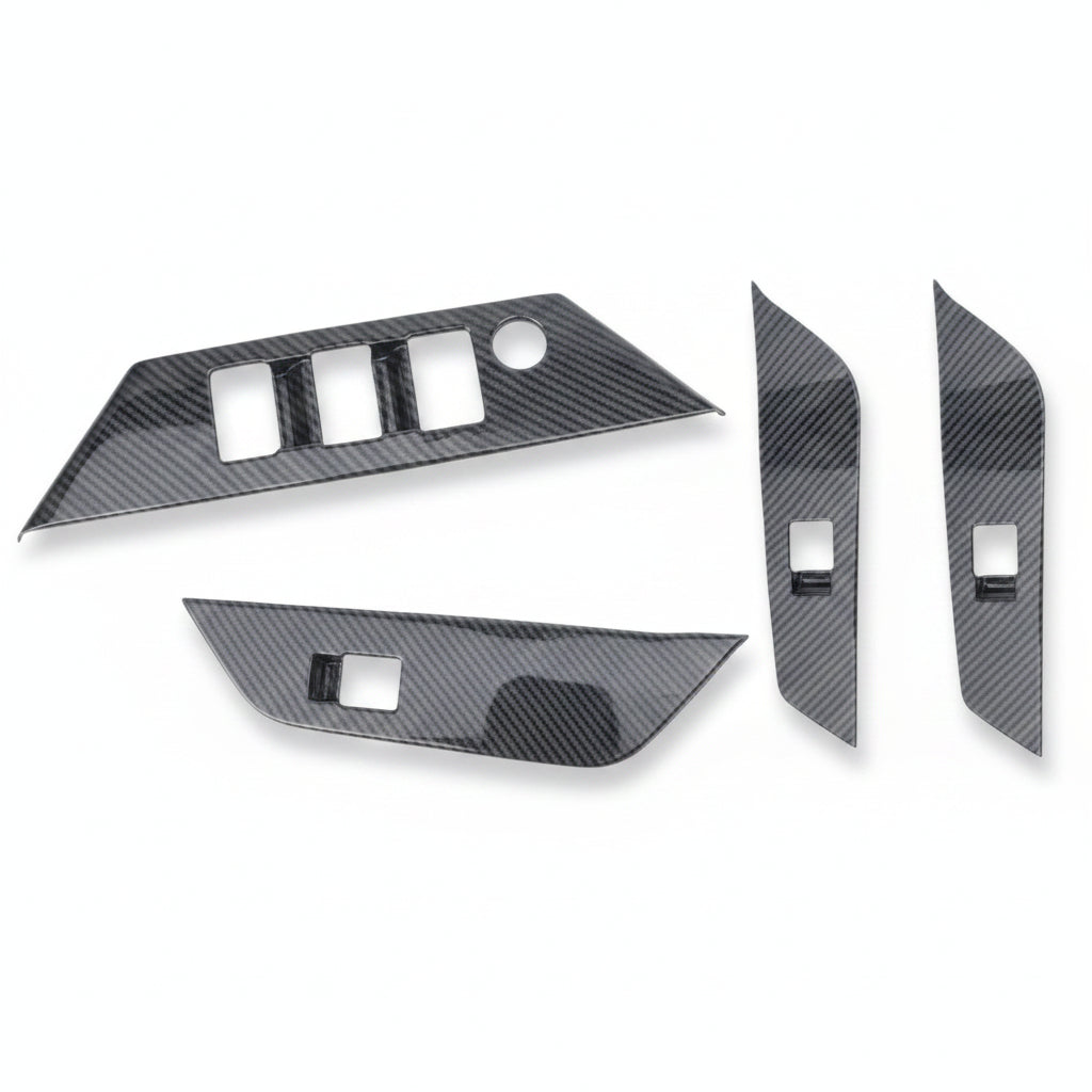Carbon fiber door panel inserts on a white background