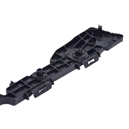 Black plastic component on a white background