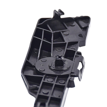 Black plastic component on a white background