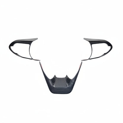 Carbon fibre steering wheel trim for Hycross on a white background