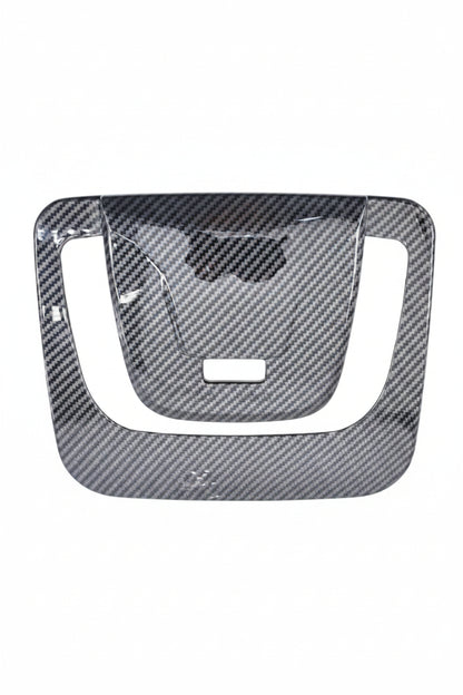 Carbon fiber patterned car dashboard cover on a white background