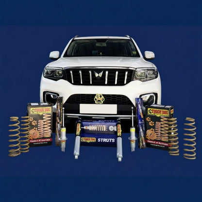White SUV with automotive parts and components displayed in front on a blue background