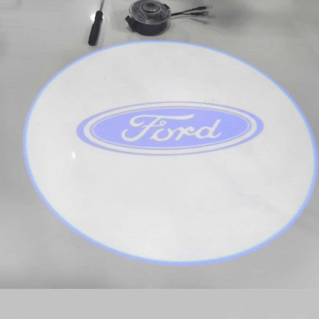 Ford logo on a round white mat with tools in the background