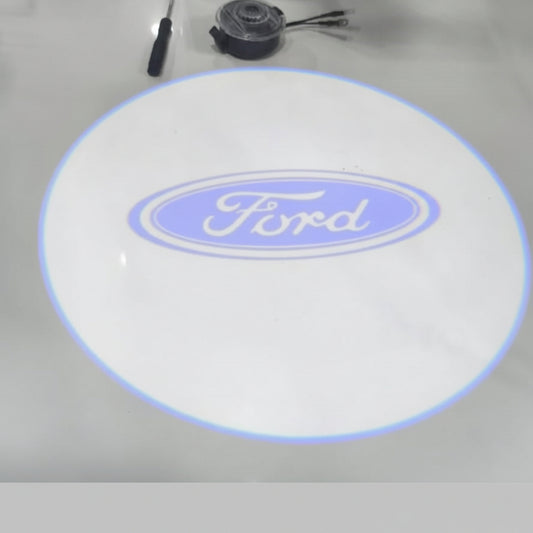 Ford logo on a round white mat with tools in the background