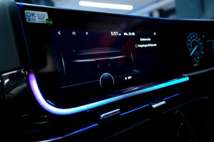 Car dashboard with digital display and blue LED strip