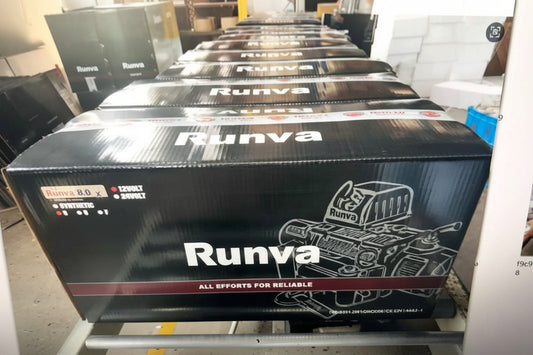 Row of Runva branded boxes on a conveyor belt