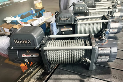Runva winch with rope on a table with other equipment in the background