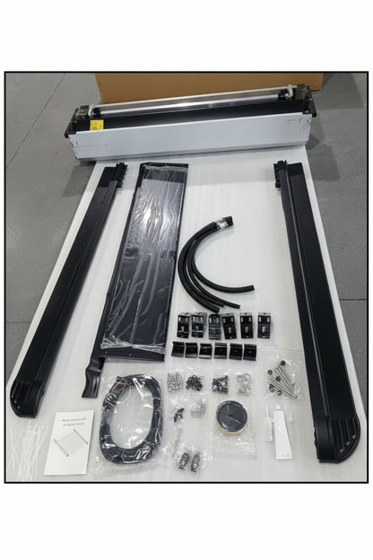 Set of mechanical parts and tools on a white surface with a gray floor background