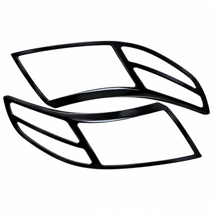 Pair of Black Headlight cover for Bolero Neo on a clear white background. 