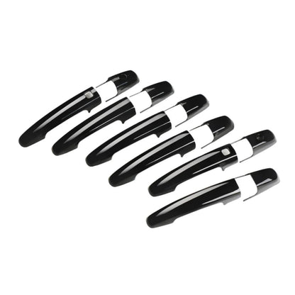 Set of Black door handle covers for Baleno, displayed on a white background.