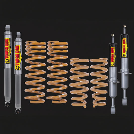 Tough Dog suspension components including shock absorbers and springs on a black background