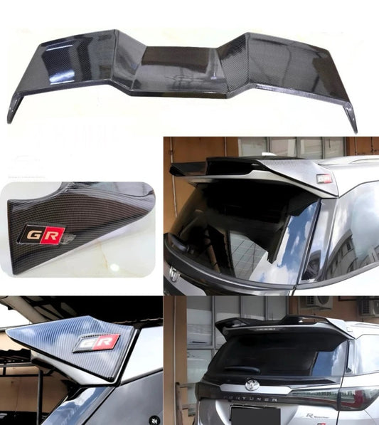 A carbon fiber rear spoiler wing shown in multiple views, including a clean product shot, close-up of the carbon weave, and installed views on a silver vehicle. The spoiler features a carbon fiber pattern and a red and black 'GR' badge.