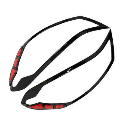 Set of 2 pcs black headlight covers for i10 Grand Nios, displayed on a white background. 