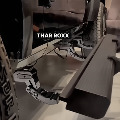 Close-up of a vehicle's off-road bumper with 'THAR ROXX' branding.