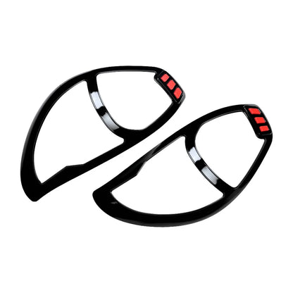 A pair of hybrid black head light garnishe for Alto 800 on a white background. 
