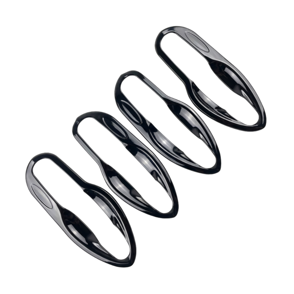 Set of 4 pcs black catch covers for Ertiga, displayed on a white background. 