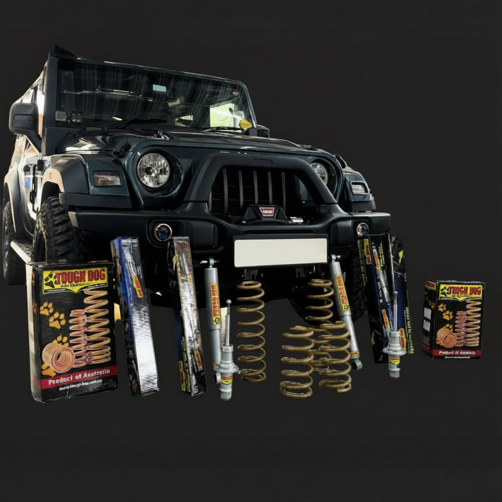 Black off-road vehicle with automotive parts and 'Tough Dog' packaging on a black background