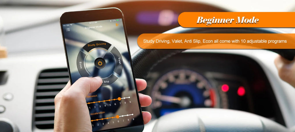 A hand holds a smartphone displaying a driving training app interface inside a car, with the dashboard, steering wheel, and speedometer blurred in the background. Orange text banners read 'Beginner Mode' and describe adjustable programs.