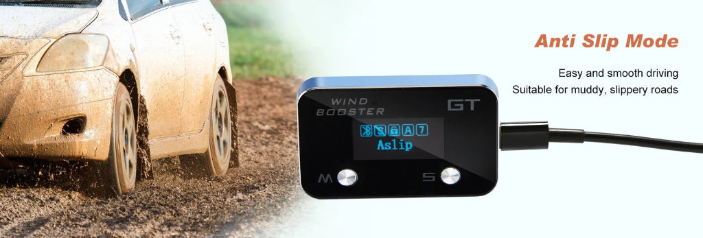 A car tire kicking up mud on a dirt road next to a black anti slip mode wind booster controller with a blue digital display screen.